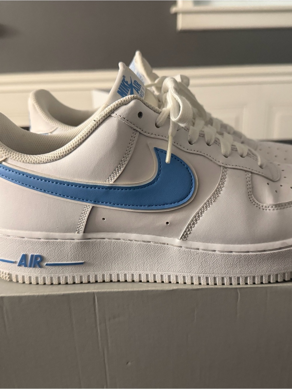 Nike White Low-Top Sneakers with Light Blue Swoosh